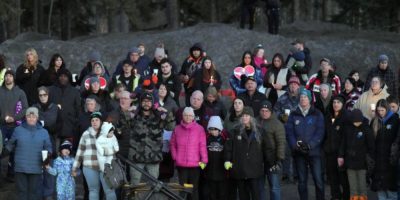People gather at a vigil for Tumbler Ridge school shooting victims