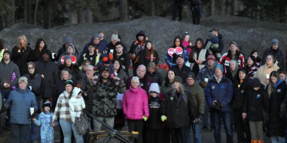 People gather at a vigil for Tumbler Ridge school shooting victims