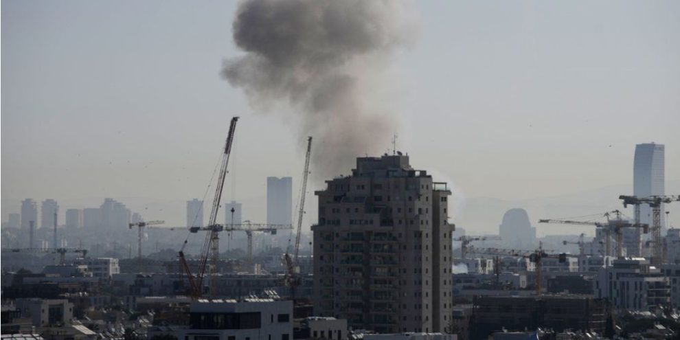Smoke rising over Tel Aviv after an Iranian missile strike as tensions escalate between Iran, Israel, and the United States