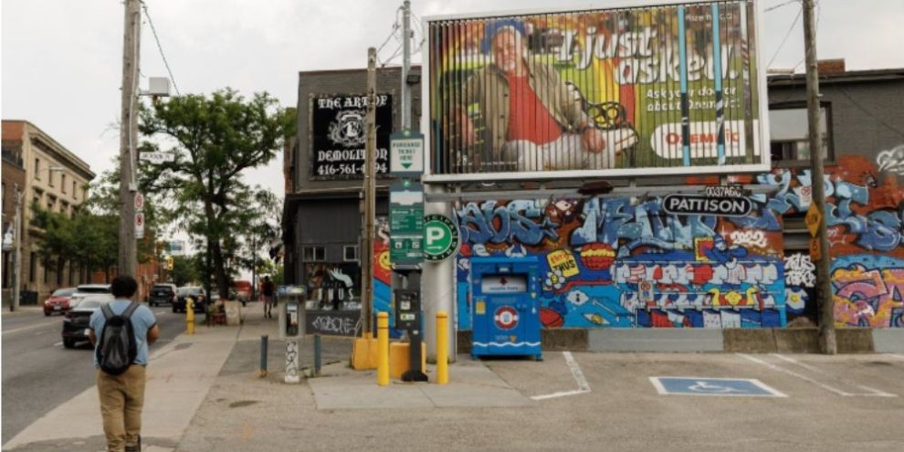 Person walking past an Ozempic billboard in Toronto