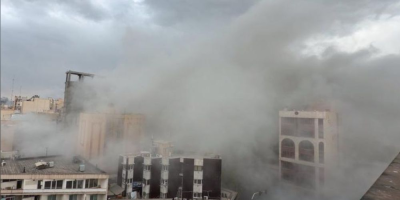 Smoke rises from a street after a strike in Tehran, Iran.