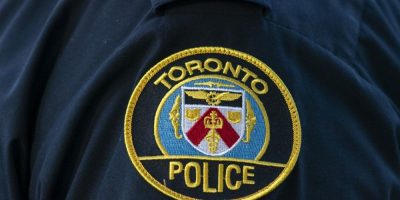 Toronto Police Service logo patch on a uniform, generic image representing police in Toronto.