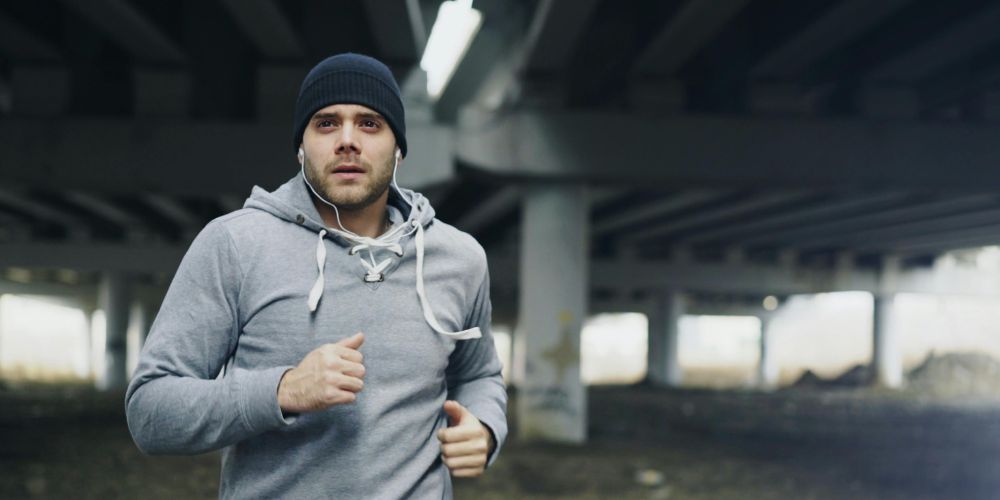 Man running and contemplating mental health