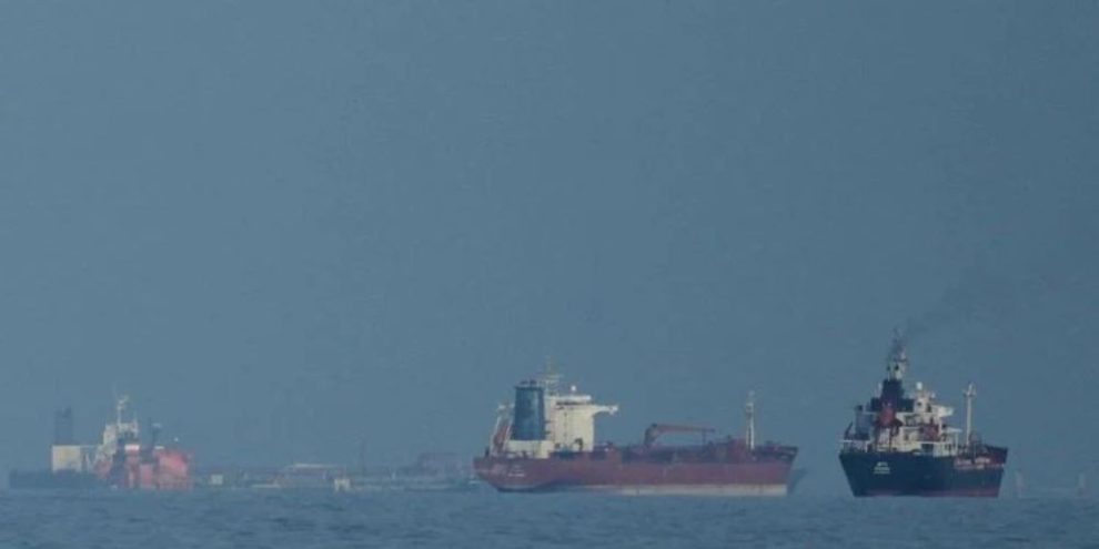 File photo of oil tankers and cargo ships lined up in the Strait of Hormuz near Khor Fakkan, United Arab Emirates, during a maritime traffic buildup.
