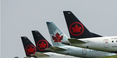 An arbitrator has ordered Air Canada to provide back pay to seven pilots denied religious COVID-19 vaccine exemptions, ruling the airline violated the Canadian Human Rights Act.