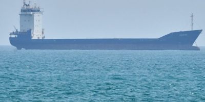 A tanker sits anchored in the Strait of Hormuz off the coast of Qeshm Island, Iran, on April 18, 2026.