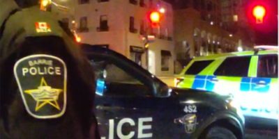 Barrie police responding to a downtown disturbance on April 1, 2026, involving a man assaulting pedestrians