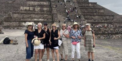 Group of B.C. tourists posing at Teotihuacan’s Pyramid of the Moon moments before a gunman, visible on the stairs behind them, opened fire