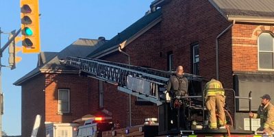 Fire truck ladder raised to a rooftop in Barrie during a domestic incident response on April 22, 2026