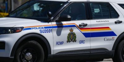 RCMP police vehicle driving in Surrey, British Columbia during law enforcement operations