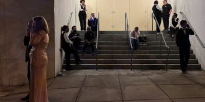 Attendees and hotel staff evacuate the Washington Hilton after a shooting during the White House Correspondents’ Dinner in April 2026.