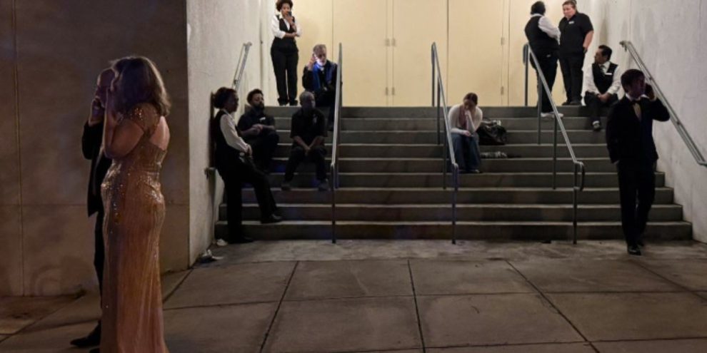 Attendees and hotel staff evacuate the Washington Hilton after a shooting during the White House Correspondents’ Dinner in April 2026.