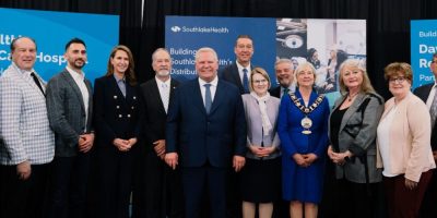 Dignitaries gather at an announcement on April 27, 2026, as the Ontario government unveils $10 million in funding for Southlake Health expansion and a new hospital project.