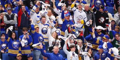 Buffalo Sabres fans cheering in the stands during Game 1 of their playoff series against the Boston Bruins in Buffalo, New York.