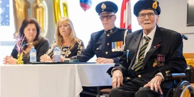Burdett “Burd” Sisler celebrates his 110th birthday at a Royal Canadian Legion in Fort Erie, Ontario, surrounded by family and community members.