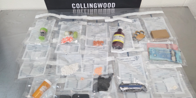 Evidence seized by OPP in Collingwood following the arrest of a Wasaga Beach suspect, including drugs, weapons, and cash