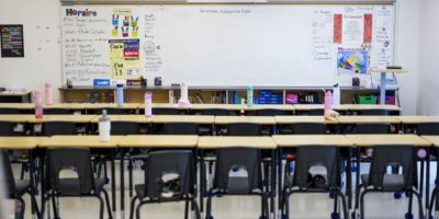 Empty classroom at Wazoson Public School in Ottawa, Ont., with rows of student desks and chairs.