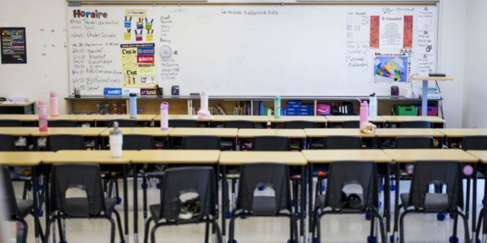 Empty classroom at Wazoson Public School in Ottawa, Ont., with rows of student desks and chairs.
