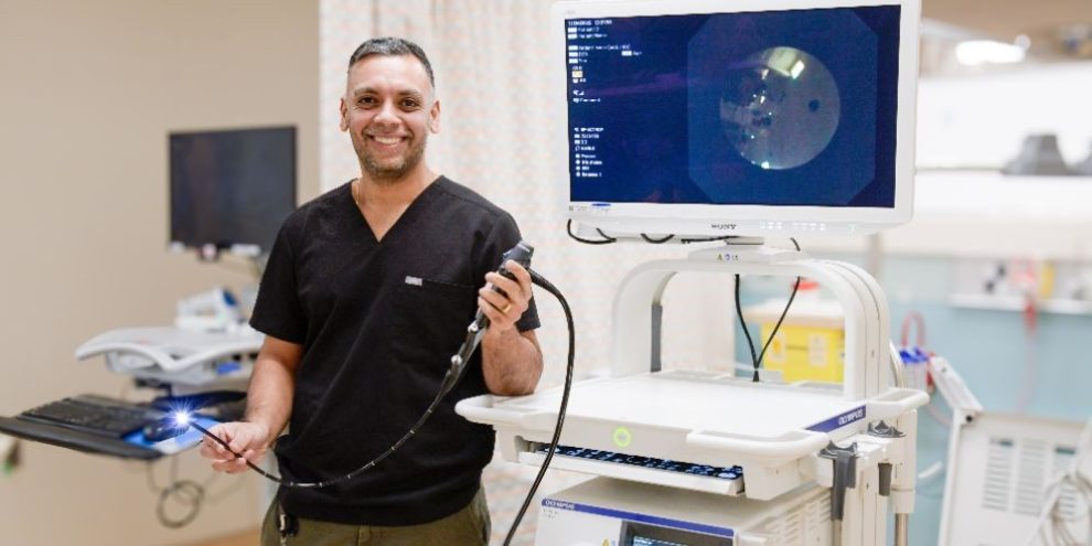 Dr. Ali Malik, respirologist and interventional pulmonologist at Royal Victoria Regional Health Centre, standing with the hospital’s Endobronchial Ultrasound (EBUS) system used for minimally invasive lung testing.