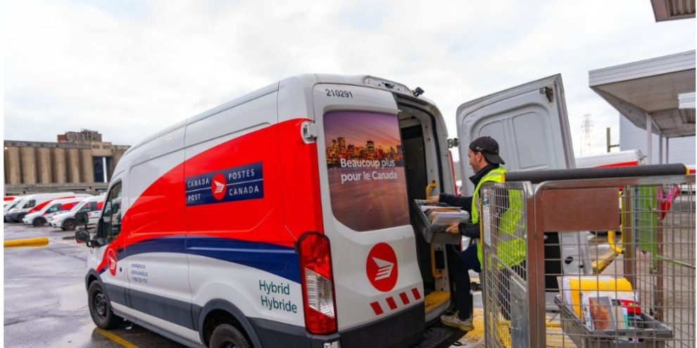 Canada Post worker loading mail into a delivery truck in Montreal on Dec. 17, 2024