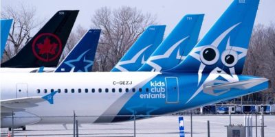 Air Transat and Air Canada aircraft parked on the tarmac at Montreal-Trudeau International Airport in Montreal