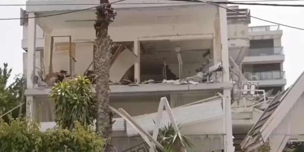 Rescue crews clear debris from a damaged home in Ramat Gan after Iranian missile strike amid escalating Middle East conflict