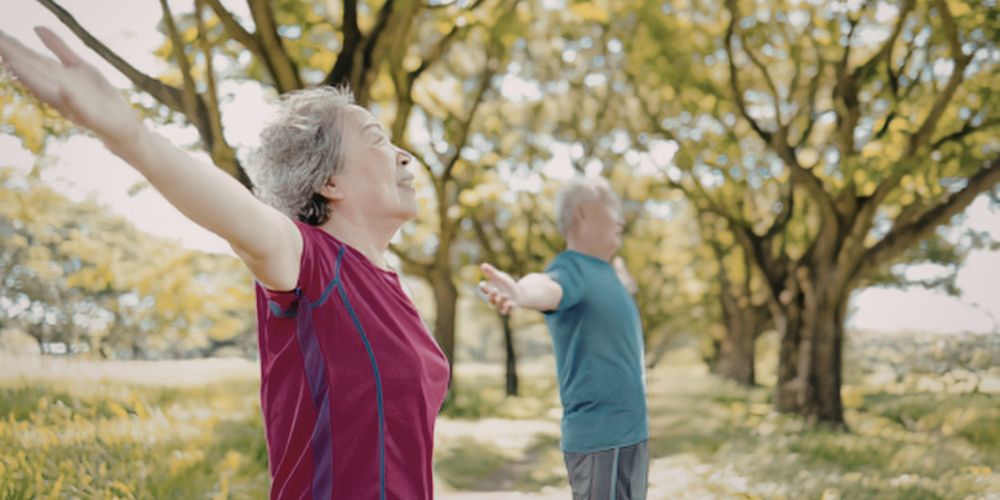Man and woman stretching outside