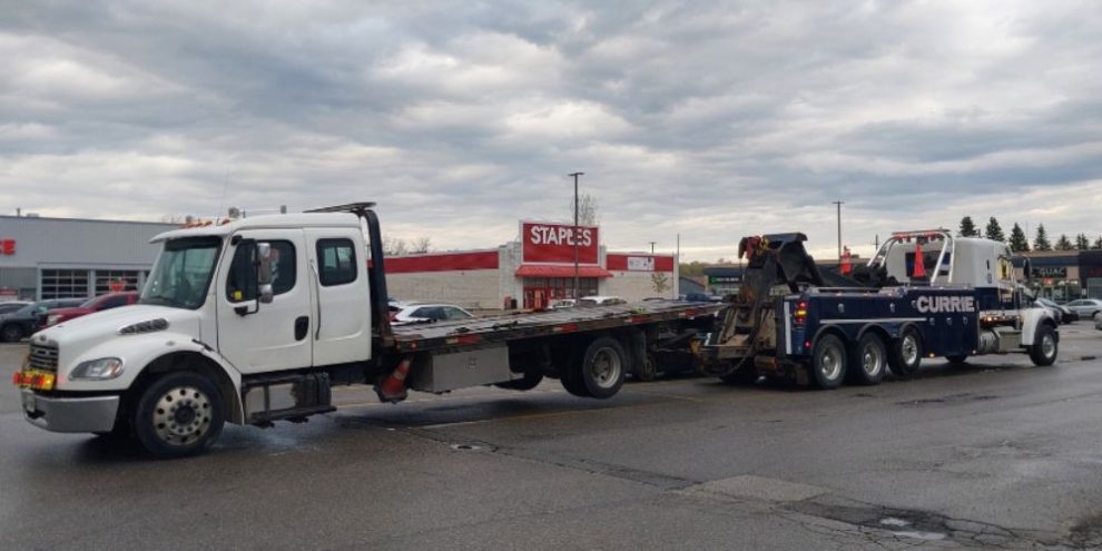 Tow truck sitting on the hoist of another tow truck in Alliston on May 9, 2026, after a driver was charged with impaired driving following an OPP investigation.