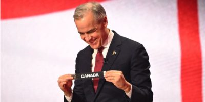 Prime Minister Mark Carney reacts during the draw for the 2026 FIFA World Cup at the Kennedy Center in Washington in December 2025.