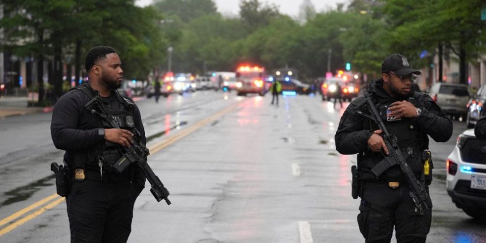 Police and Secret Service officers block streets near the White House after a shooting involving an armed suspect in Washington on May 23, 2026.