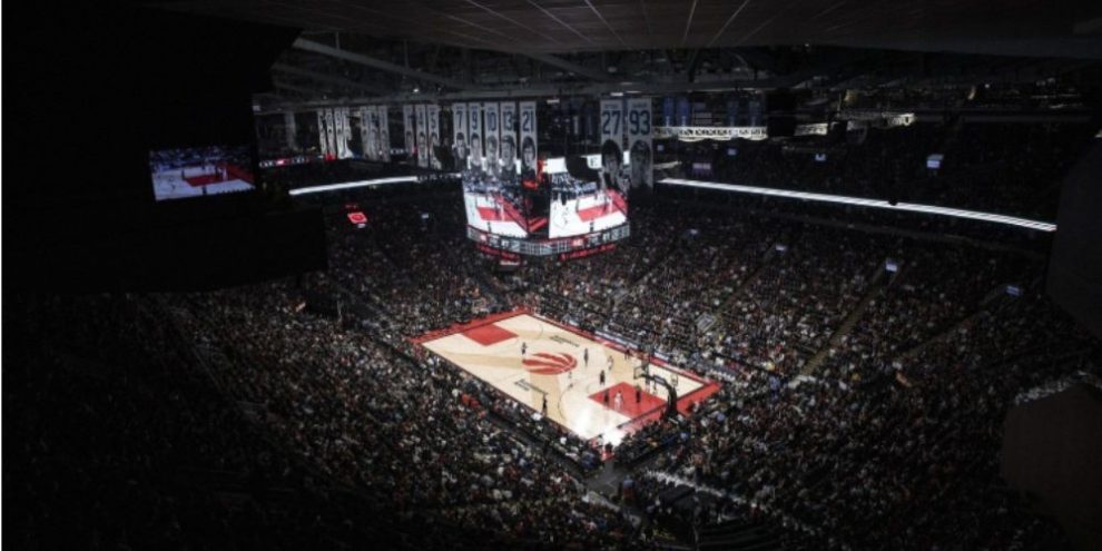 Fans watch the Toronto Raptors play the Philadelphia 76ers during an NBA playoff game in Toronto in April 2022