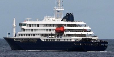The MV Hondius cruise ship docked in Praia, Cape Verde, with public health officials investigating a hantavirus outbreak linked to passengers.