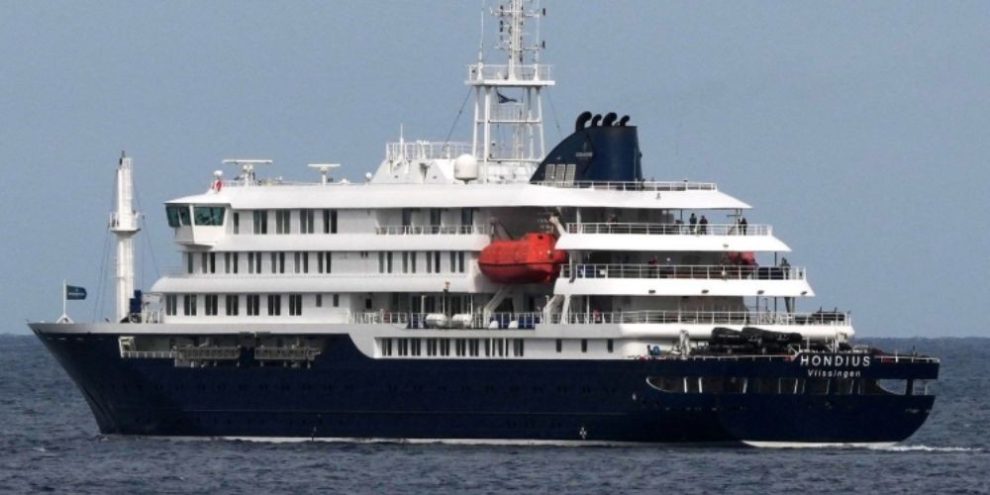 The MV Hondius cruise ship docked in Praia, Cape Verde, with public health officials investigating a hantavirus outbreak linked to passengers.