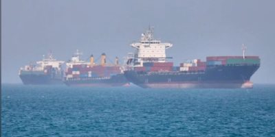 Container ships anchored in the Strait of Hormuz off Bandar Abbas, Iran, amid rising tensions over ceasefire negotiations between Iran and the United States in May 2026.