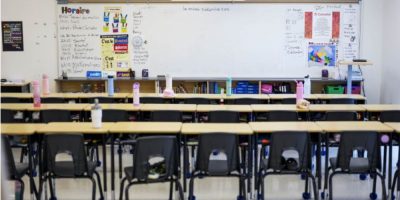 Empty classroom with student desks and chairs at Wazoson Public School in Ottawa-Carleton District School Board, Ottawa, showing a typical Ontario elementary school learning environment.