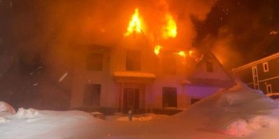Firefighters with the Oro-Medonte Fire Department battle a blaze just before midnight on Feb. 10, 2026, at an unoccupied home on Bass Lake Side Road at Line 3 in Oro-Medonte Township.
