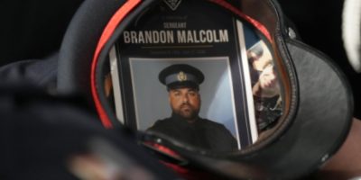 The hat of Ontario Provincial Police Sgt. Brandon Malcolm is displayed during his funeral service in Cobourg, Ont., on May 6, 2026.