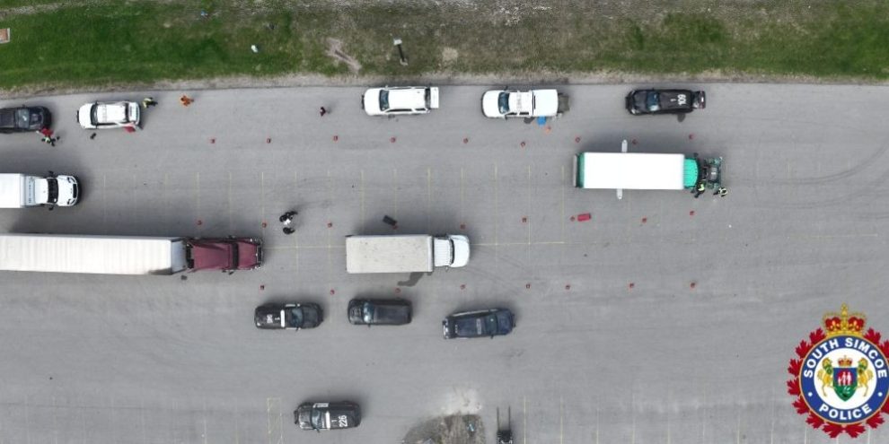 South Simcoe Police, Ontario Provincial Police, and Ministry of Transportation officers conducting a commercial vehicle safety inspection blitz at the Bob Fallis Arena in Bradford West Gwillimbury on April 30, 2026.