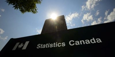 The Statistics Canada headquarters building in Ottawa with agency signage visible outside.