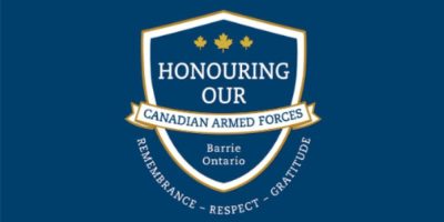 Barrie downtown City Hall area with streets closed for a parade and Canadian Armed Forces personnel participating in a ceremonial event.