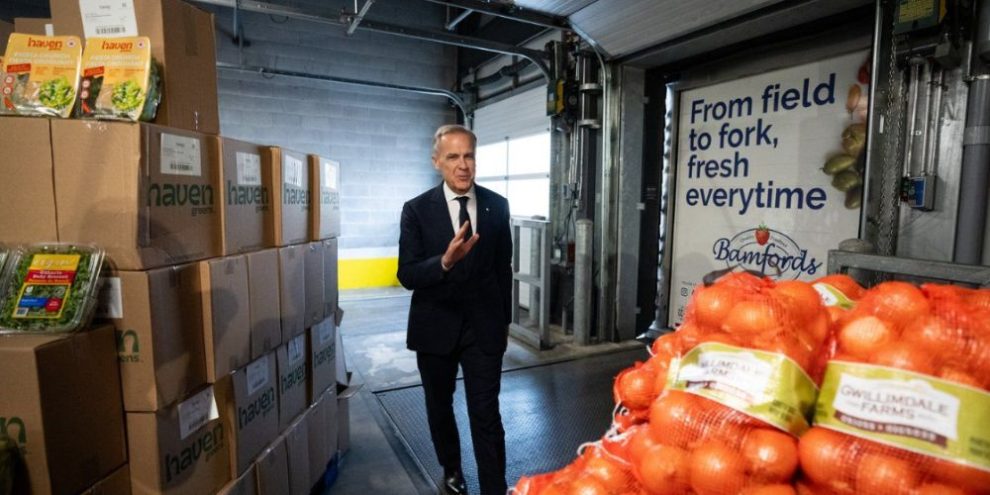 Prime Minister Mark Carney arrives at the Ontario Food Terminal in Toronto before announcing a national food security strategy aimed at lowering grocery prices and increasing Canadian food production.
