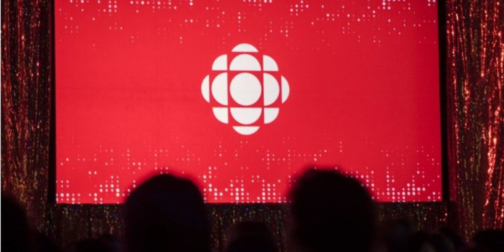 The CBC logo projected on a screen in Toronto during a media event, representing the broadcaster’s long-running connection to Hockey Night in Canada.