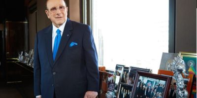 Clive Davis, influential music executive, seated in a New York office portrait.