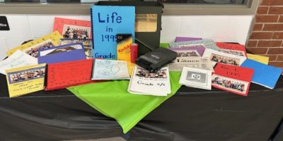 Students, staff and former graduates gather at Coldwater Public School in Coldwater, Ontario, as a 1995 time capsule is opened during the school's Spring BBQ.