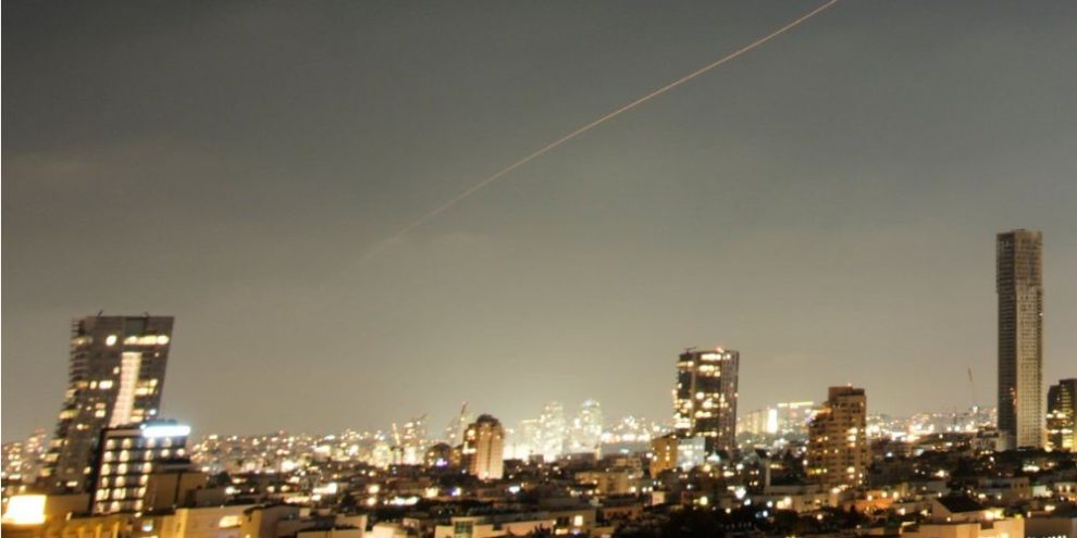 A projectile streaks through the sky over central Israel during an Iranian missile attack, Sunday, June 7, 2026