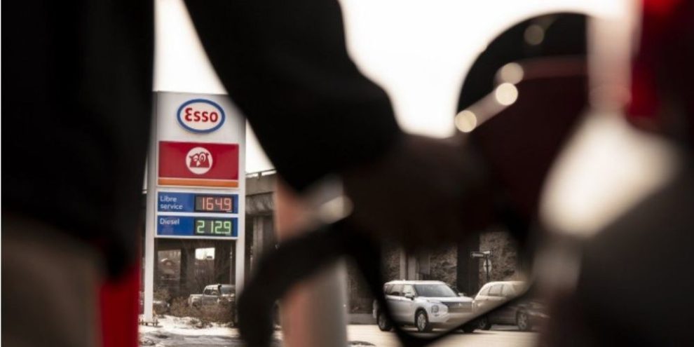A driver fills up a vehicle at a Montreal gas station as fuel prices rise, contributing to higher inflation across Canada in May 2026.