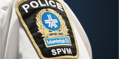 Montreal police badge displayed during a news conference in Montreal in March 2026.