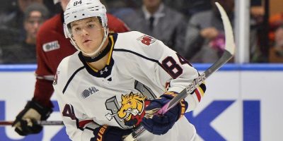 Jaiden Newton in Barrie Colts uniform during OHL action, skating with puck during game