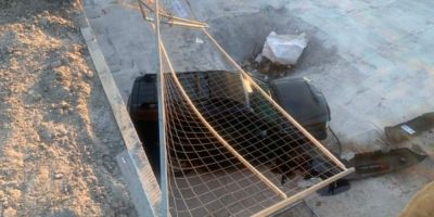 Vehicle at the bottom of a construction excavation after plunging about 11 metres through a fence at a construction site on Coulter Street in Barrie.