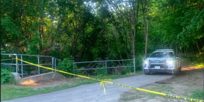 Yellow police tape blocks the entrance to Berczy Park from Peel Street near Sophia Street East in downtown Barrie.